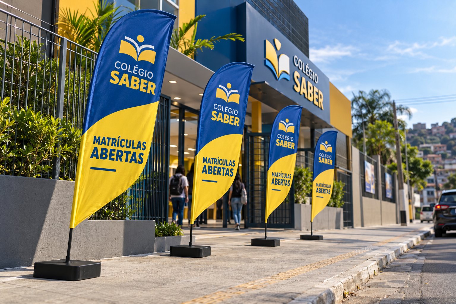 Wind banners em frente a uma escola em Mauá — Grafíssima